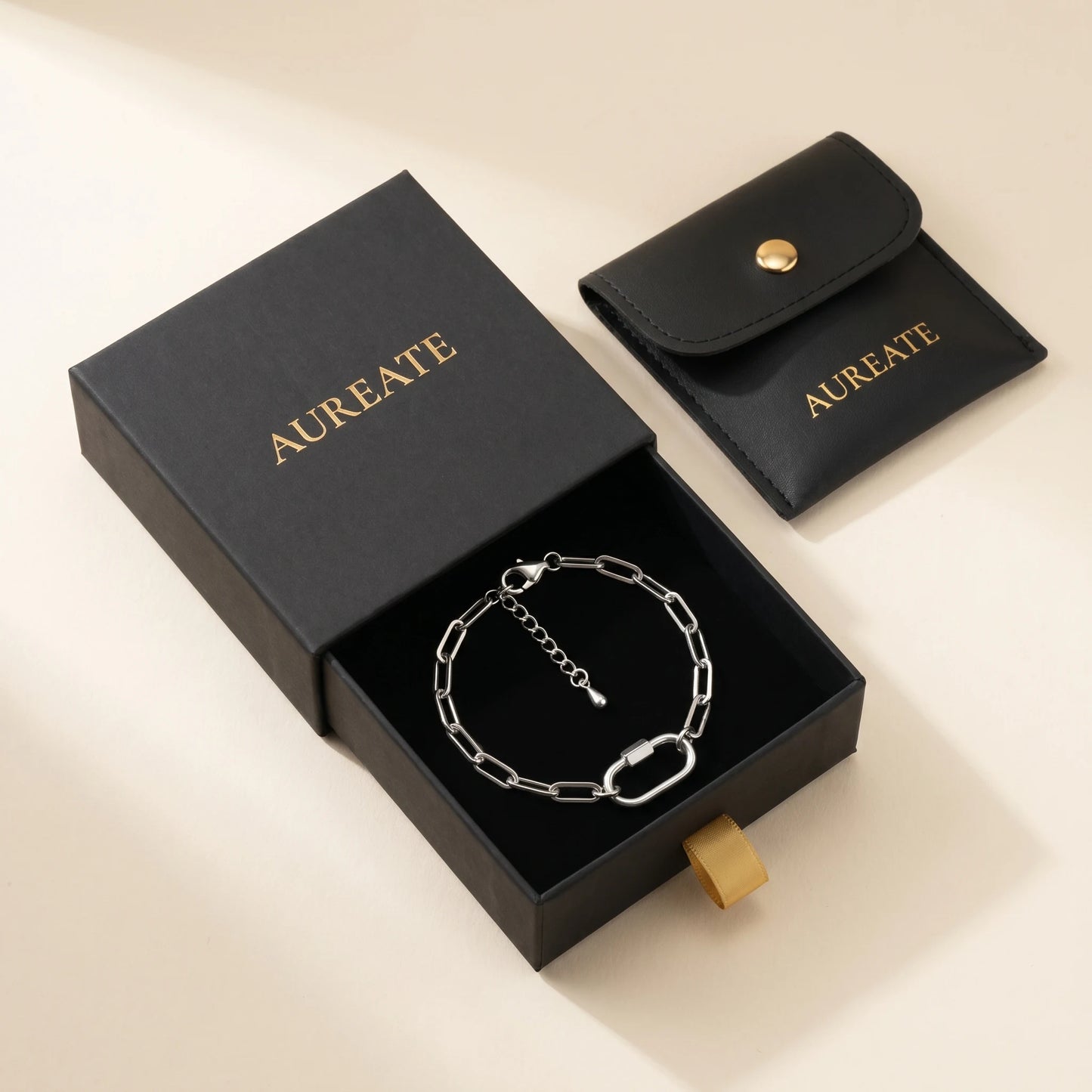 Silver paperclip bracelet with oval lock pendant in AUREATE matte black gift box - extender visible