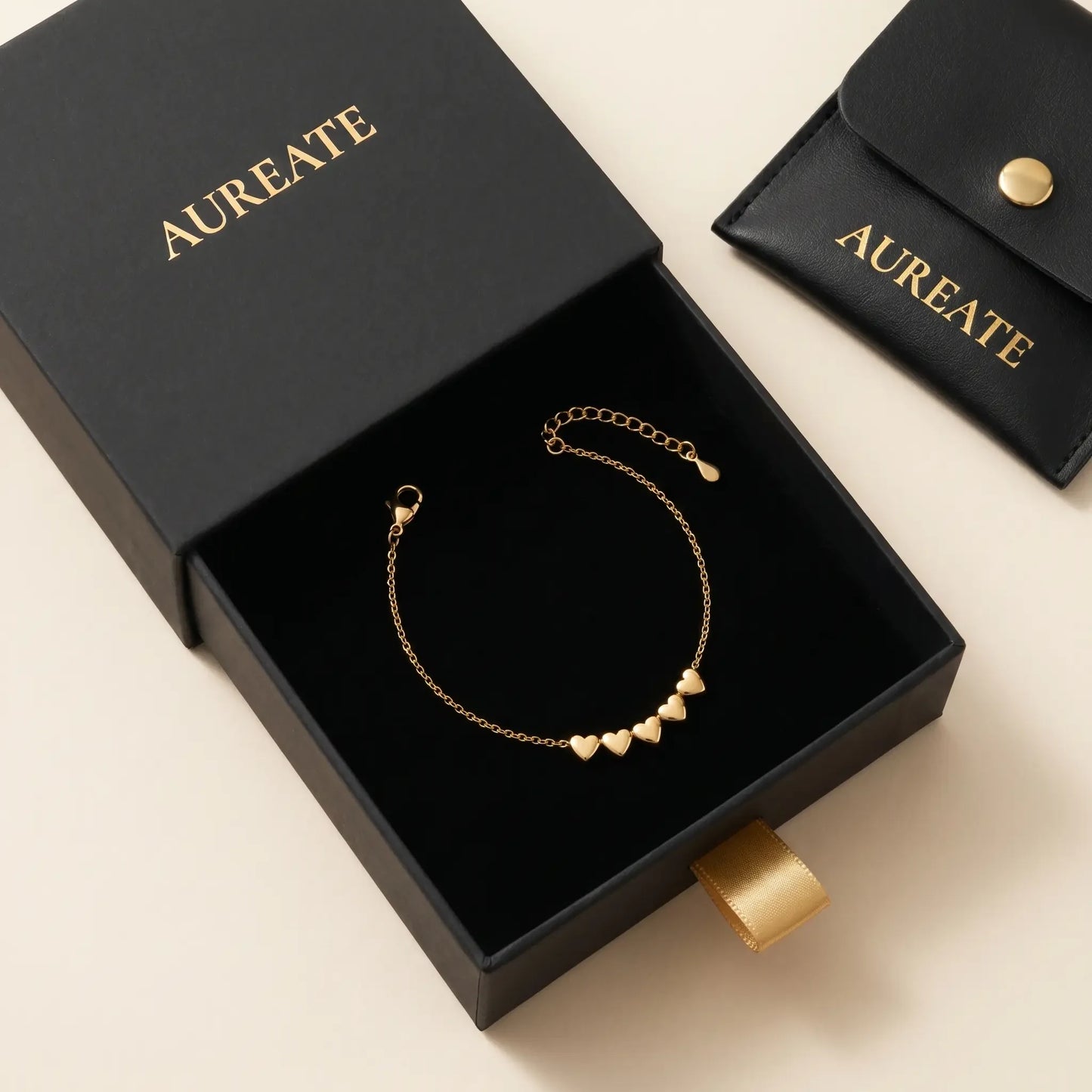 AUREATE gift box with tiny gold heart drop anklet in matte black slide-drawer with leather pouch