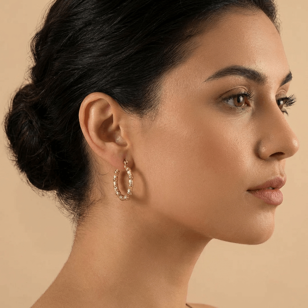 Classic Bamboo Hoop Earrings by AUREATE worn by a model, showcasing their elegant design and 18K gold plating.