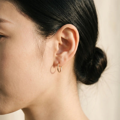AUREATE warm gold hoop earring editorial