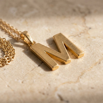AUREATE initial letter pendant editorial macro