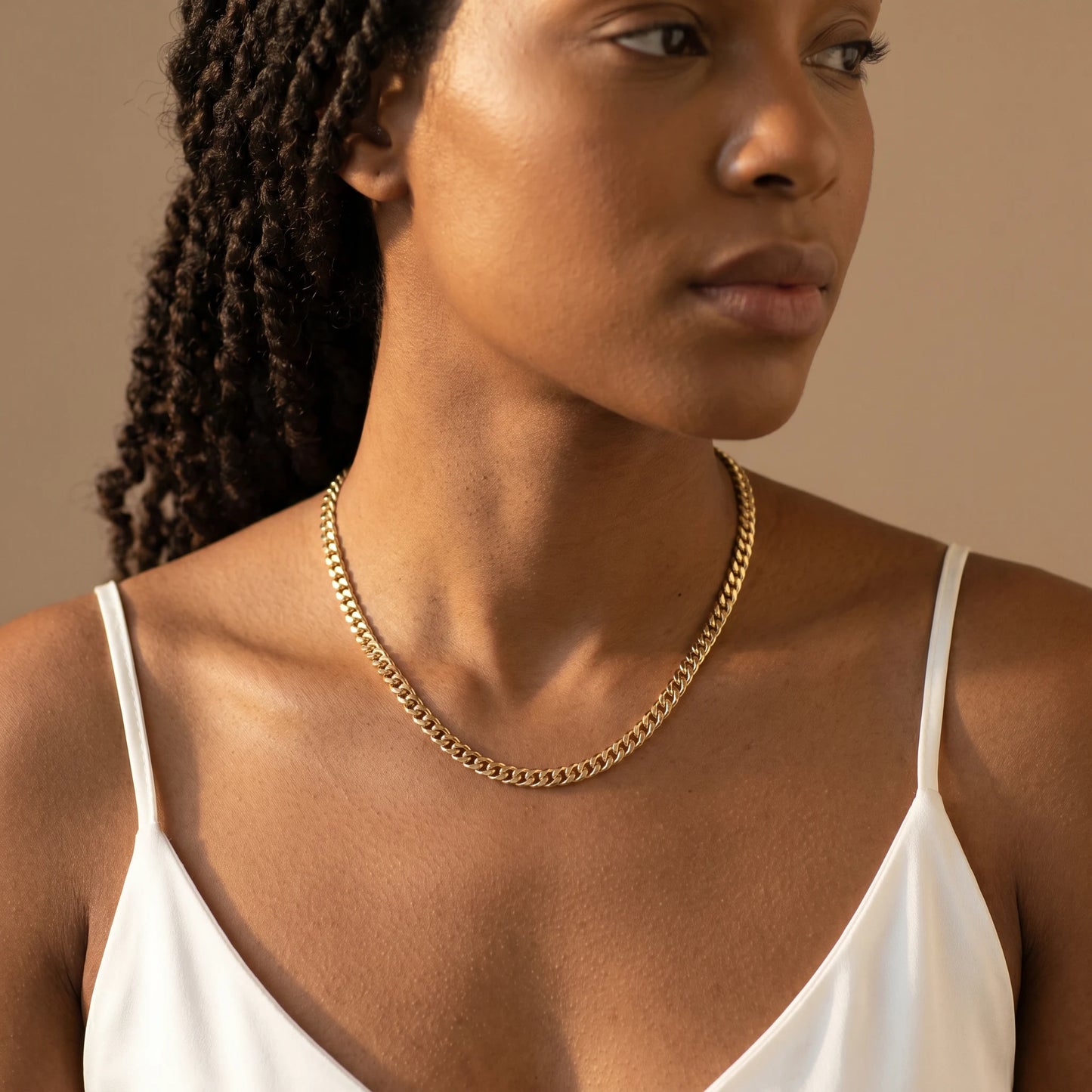 Dainty Cuban Chain Necklace gold worn close-up on collarbone editorial