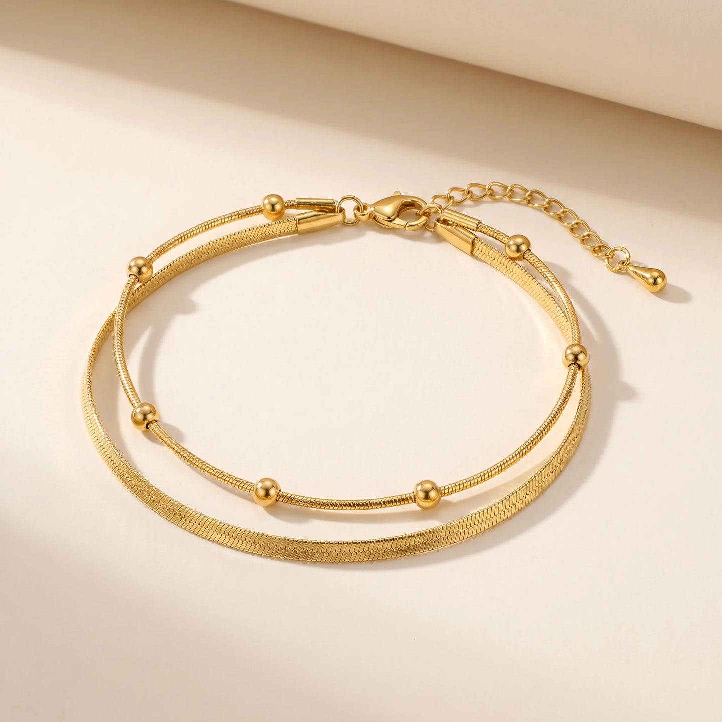 Double snake layered anklet gold studio packshot white background