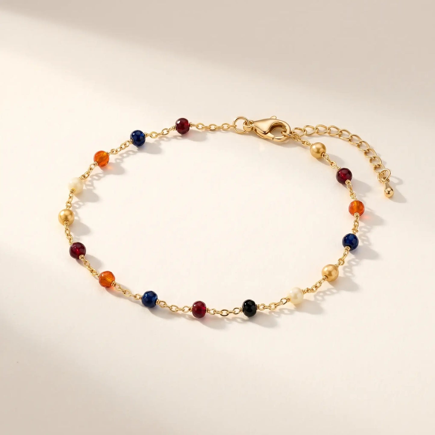 Multicolor bead anklet 18K gold cable chain packshot on cream background