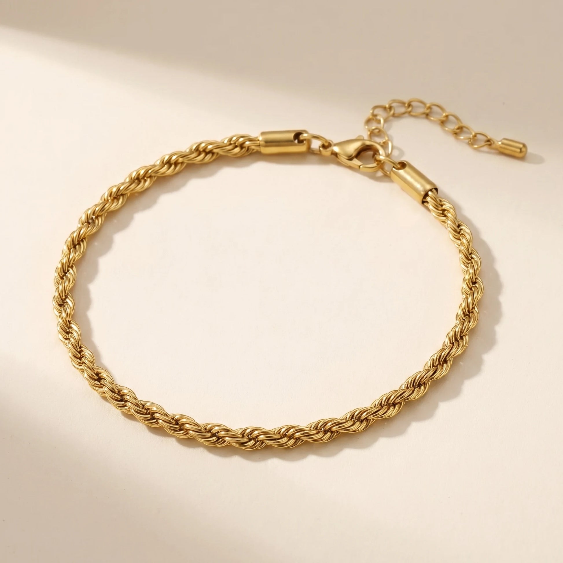 Gold rope twist chain anklet packshot off-white background