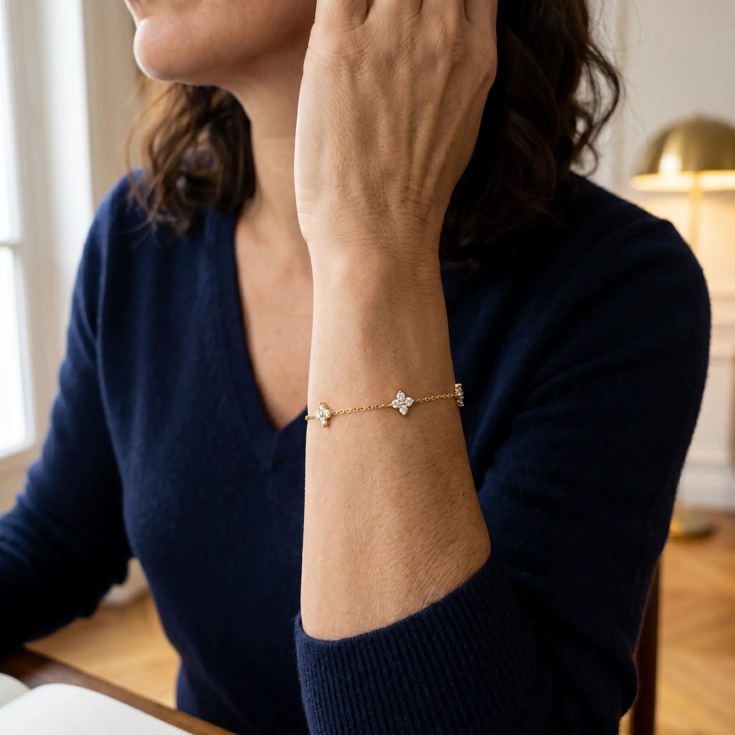 Gold clover bracelet 3/4 portrait Italian elegant mature dorsal wrist 4 charms