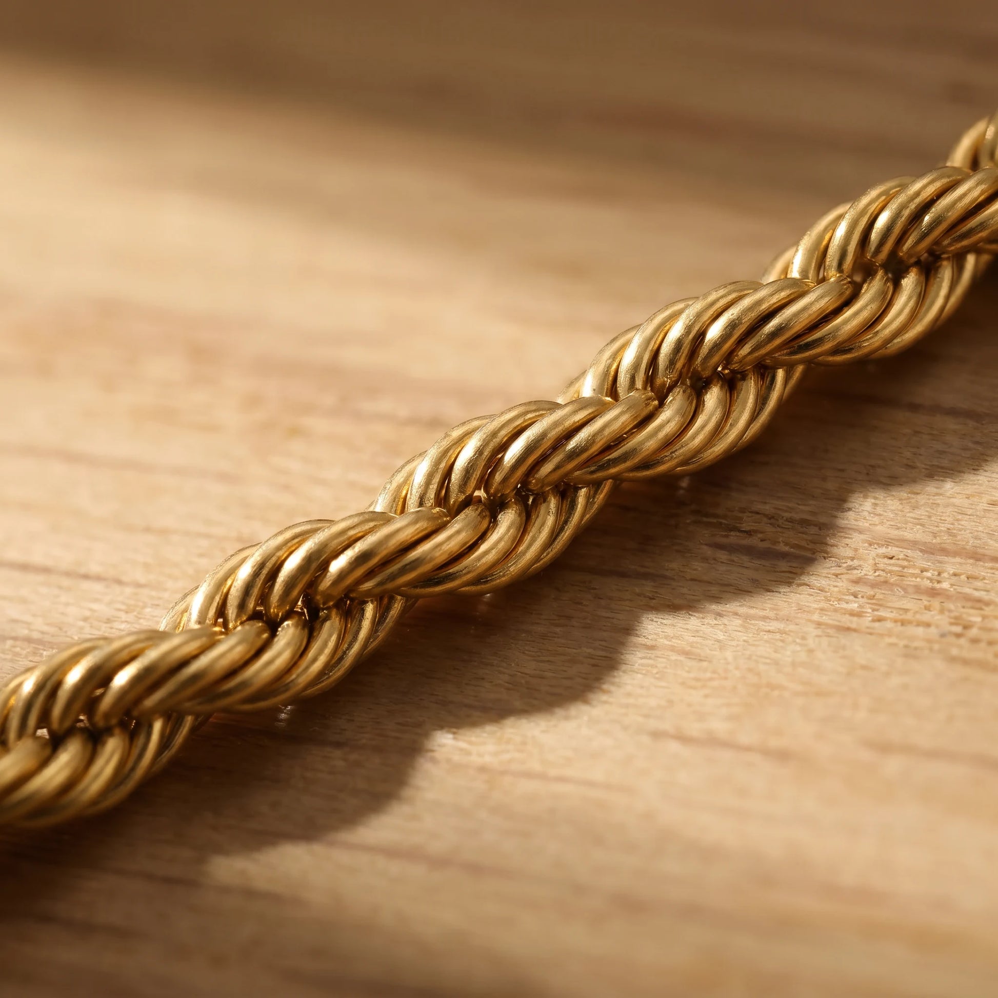 Macro detail of gold rope twist chain helical spiral pattern