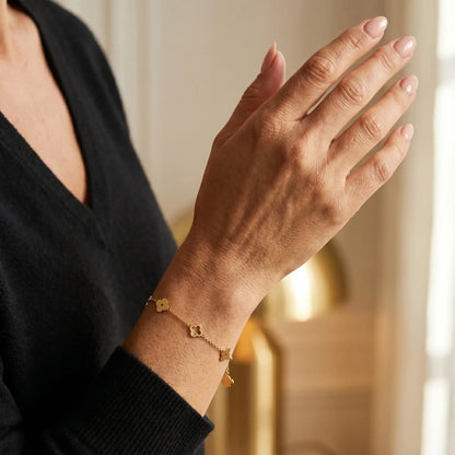 Four-leaf clover bracelet 3/4 portrait elegant Vogue editorial - gold