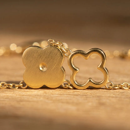 Four-leaf clover bracelet macro detail - solid and outline quatrefoils alternating