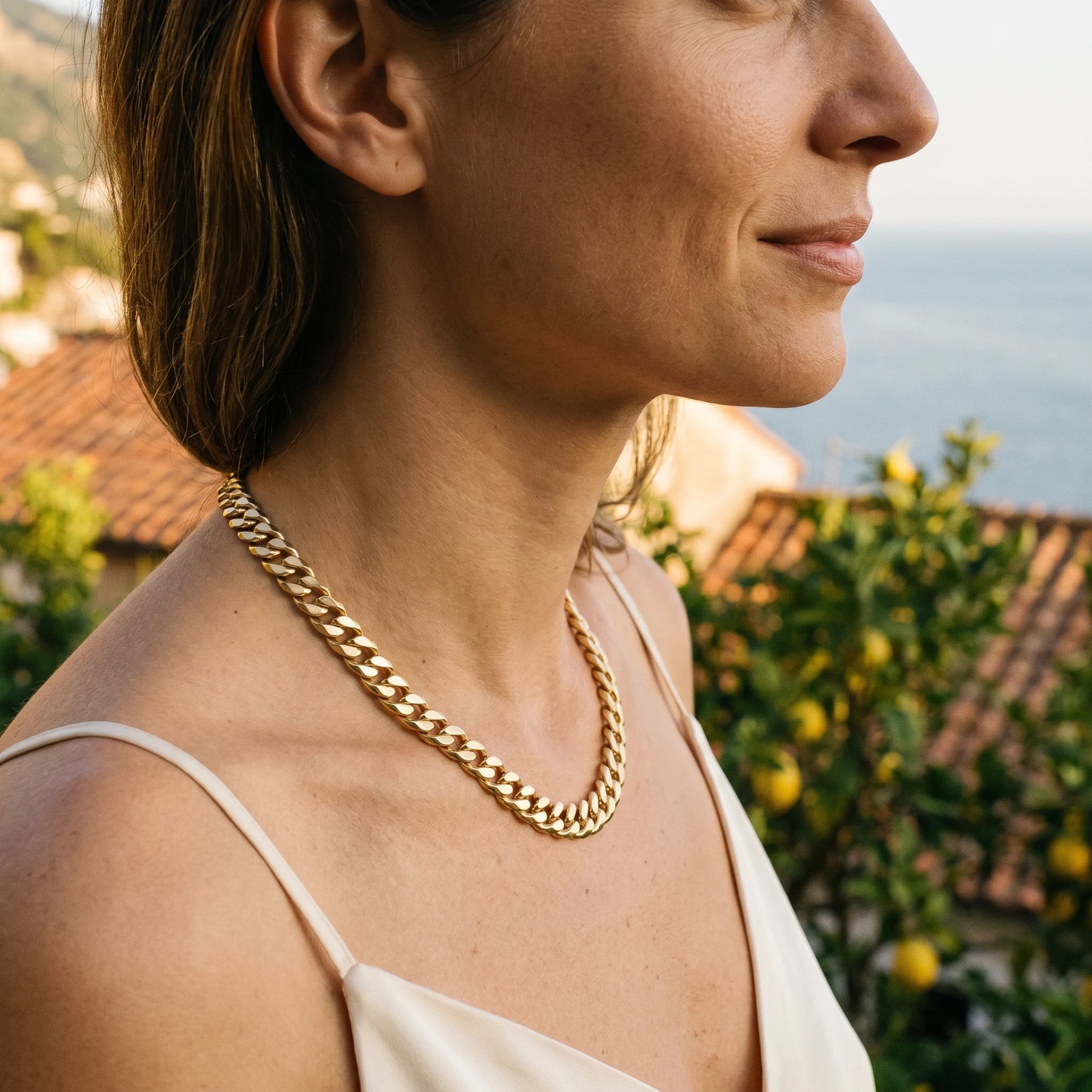 Bold curb chain necklace gold profile Mediterranean Amalfi golden hour
