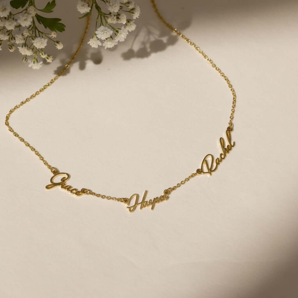 Multiple Name Necklace by AUREATE featuring names Grace, Happy, and Rachel in a gold chain design.