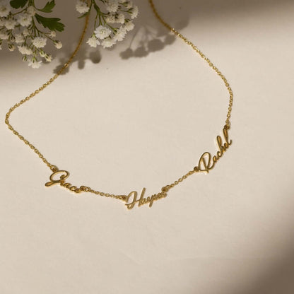 Multiple Name Necklace by AUREATE featuring names Grace, Happy, and Rachel in a gold chain design.