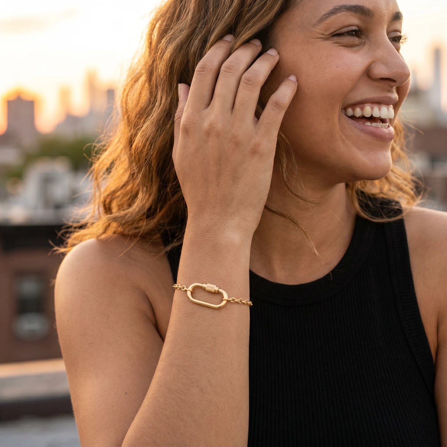 Cable chain bracelet gold — candid joy on Brooklyn rooftop