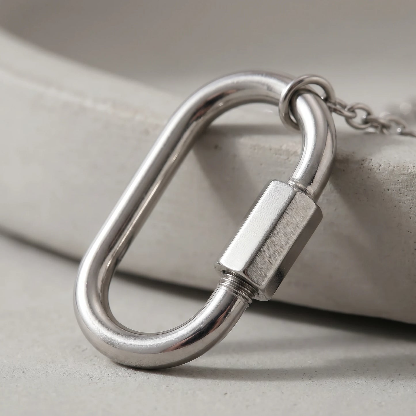 Oval carabiner buckle macro detail in silver stainless steel