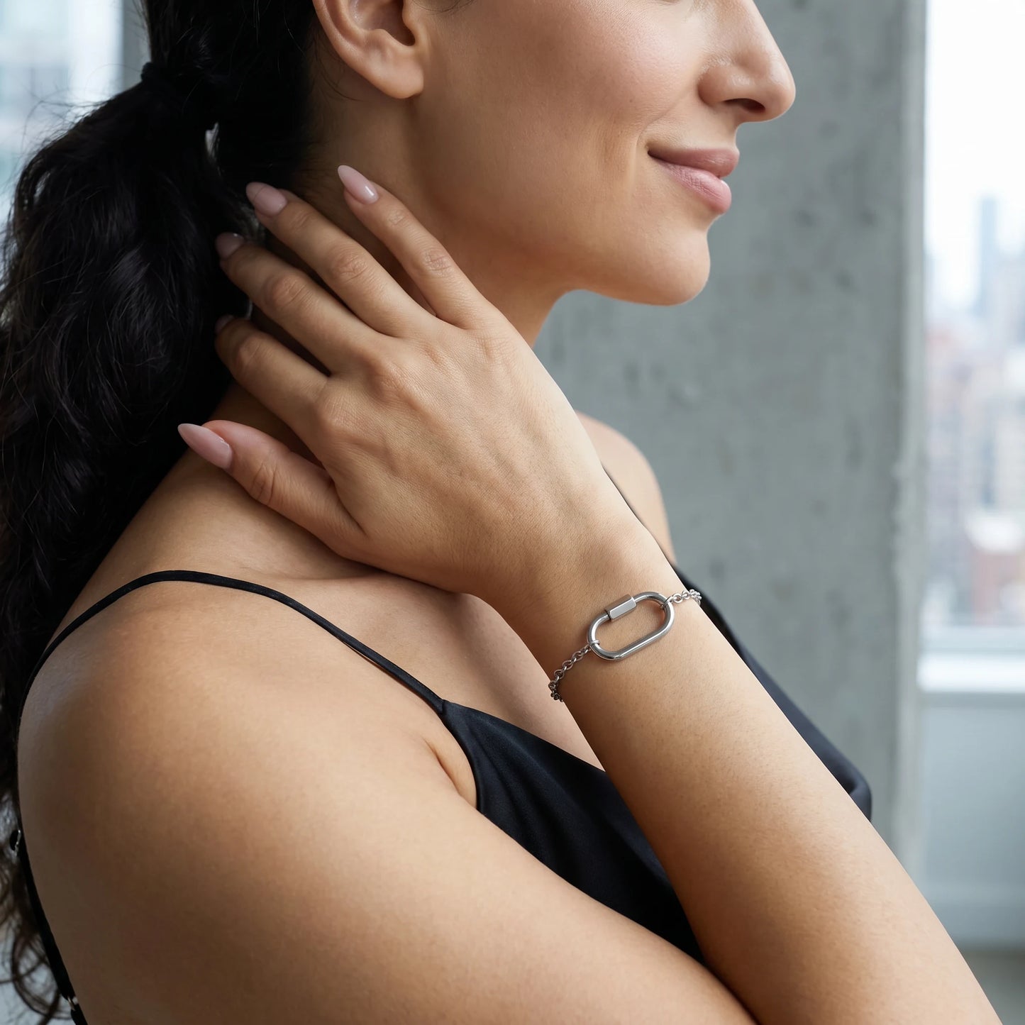 Silver dainty cable bracelet — NYC loft profile shot