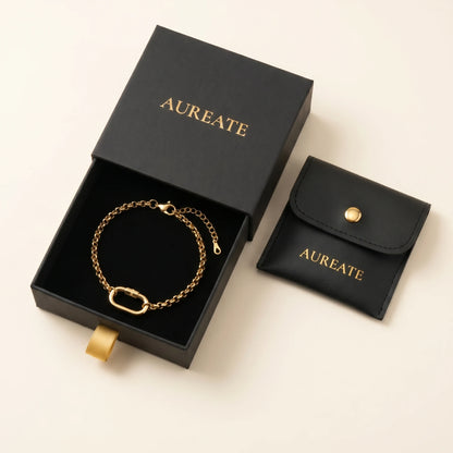 Gold rolo charm bracelet in AUREATE matte black gift box - extender visible