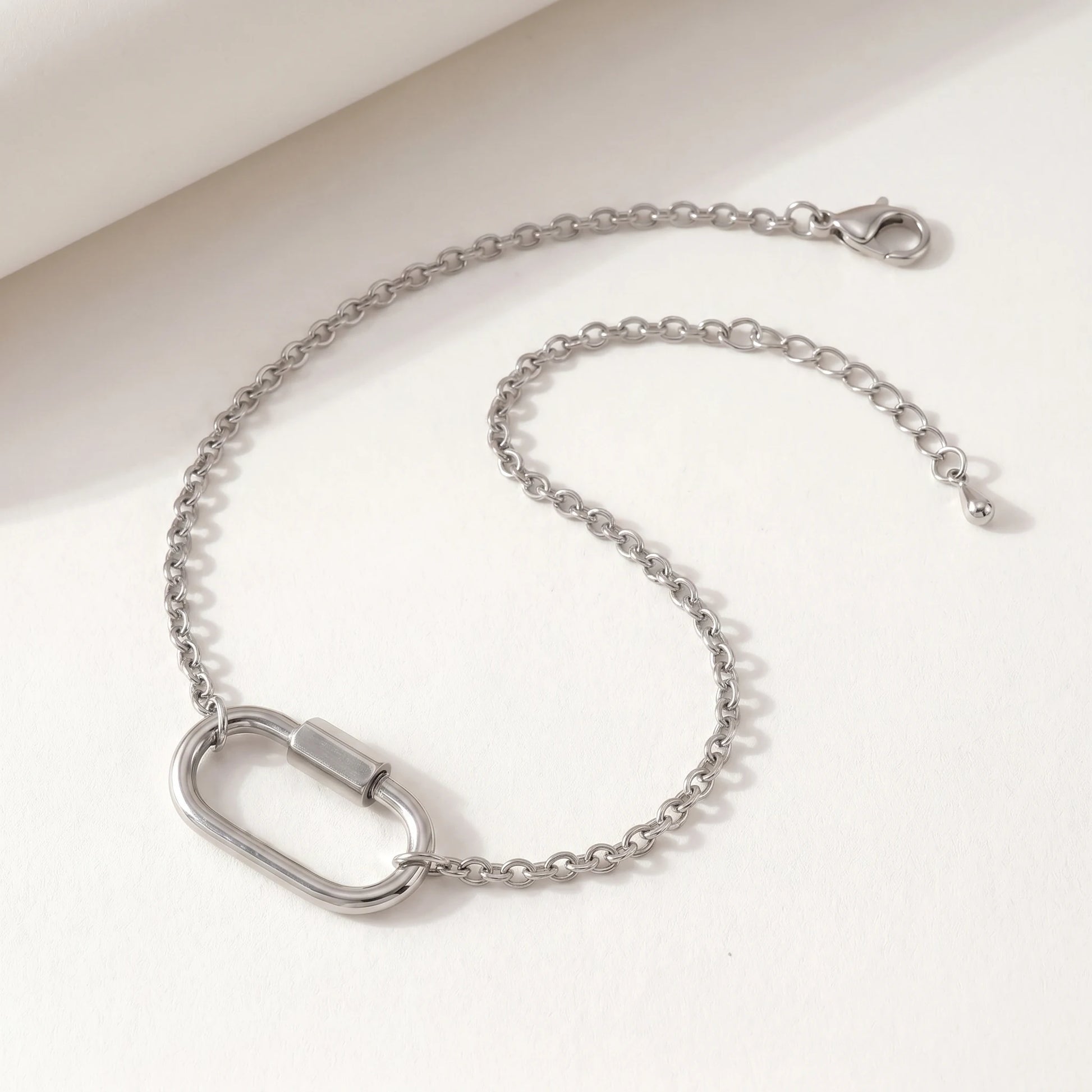Silver cable chain bracelet with oval carabiner lock pendant - packshot stainless steel with 3cm cable extender