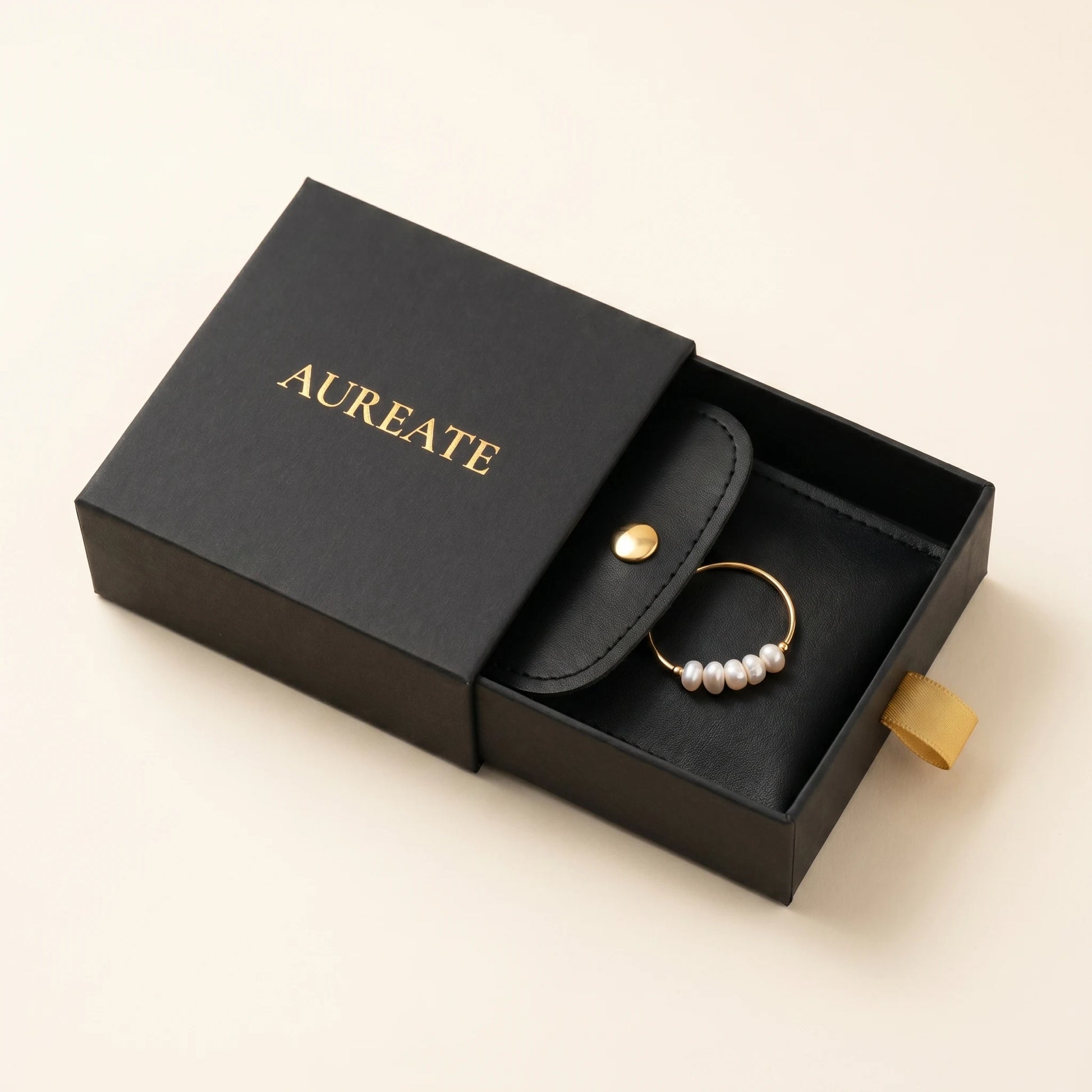AUREATE gift box with Gold Dainty Pearl Bar Ring inside black leather pouch