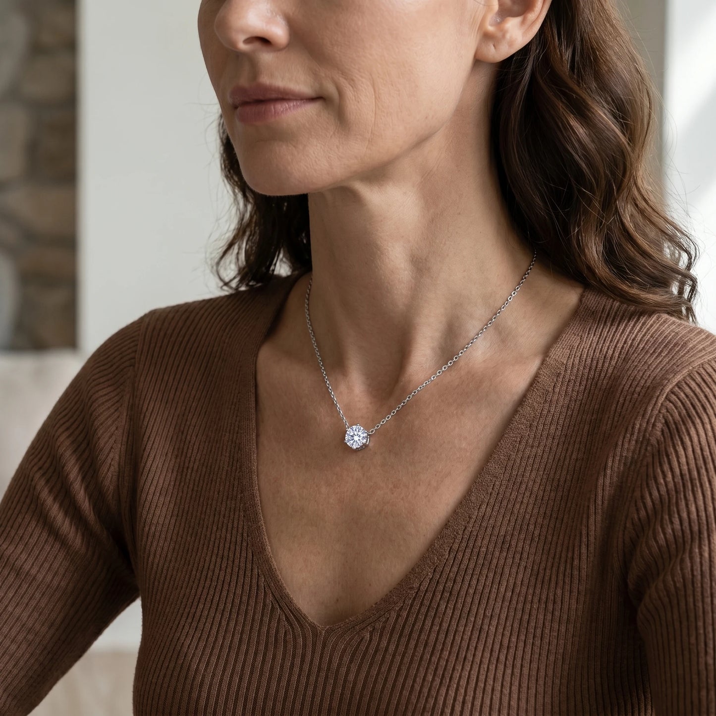 Floating Solitaire Necklace Silver Tone - 3/4 portrait on mature woman in warm brown knit
