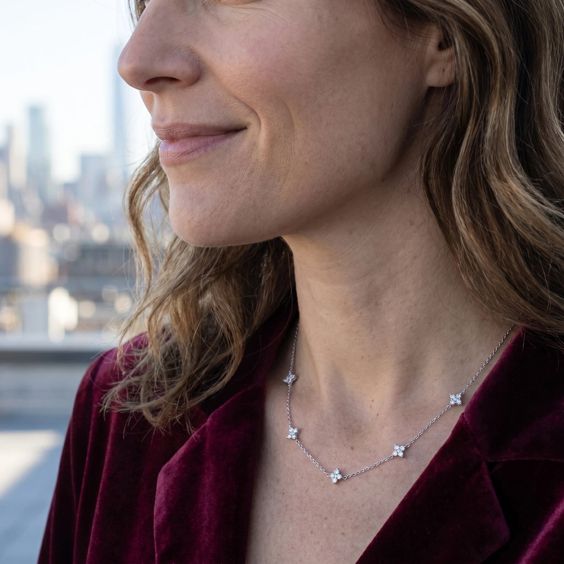 Silver clover station necklace profile NYC skyline aspirational