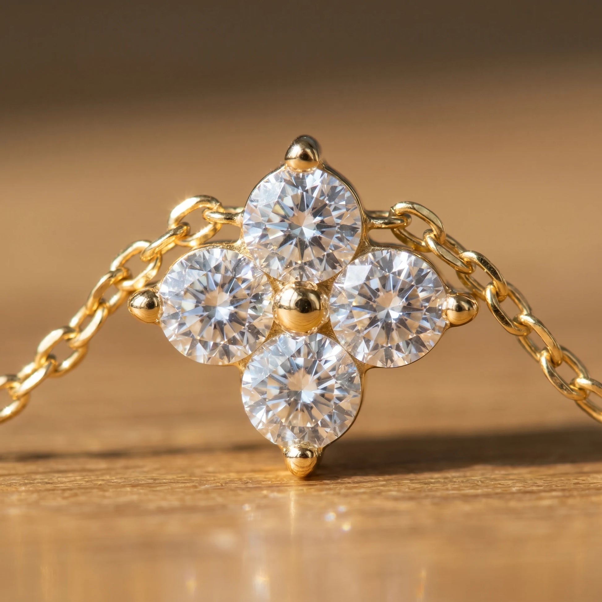 Diamond cluster necklace gold macro detail 4 brilliant CZ stones 3-prong