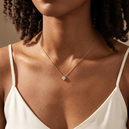 Diamond cluster necklace gold worn close-up dainty CZ pendant