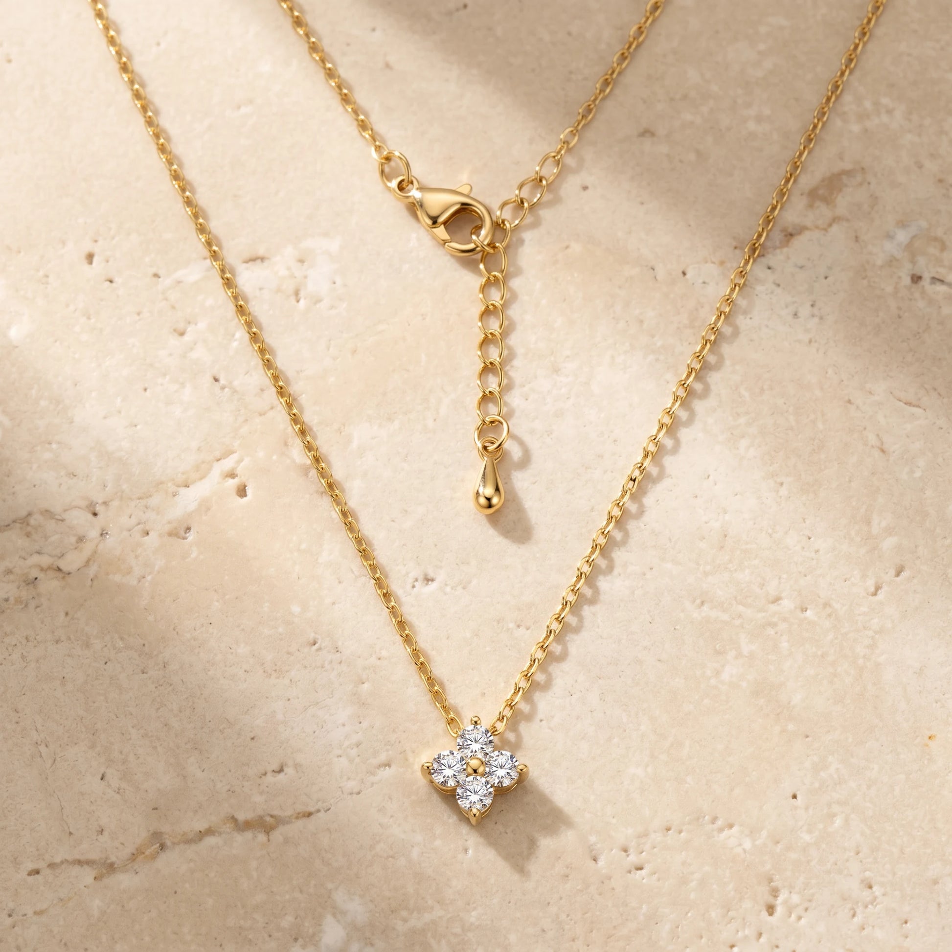 Diamond cluster necklace gold packshot 4 stone rhombus pendant