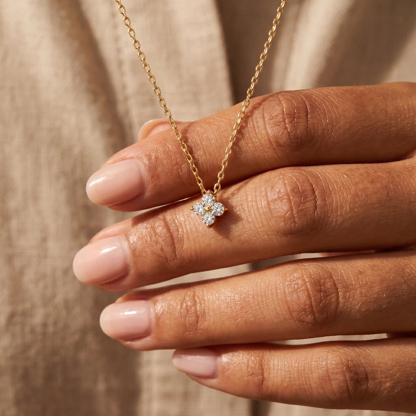 Diamond cluster necklace gold hand held intimate close up