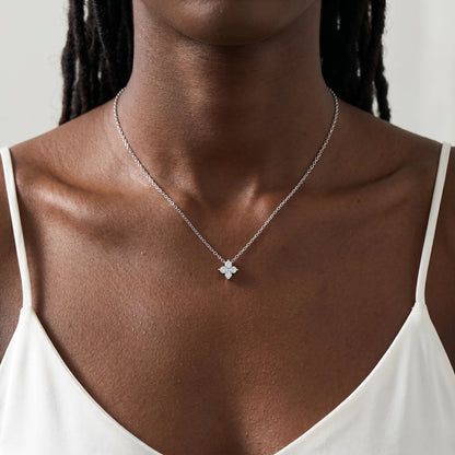 Diamond cluster necklace silver worn close up dainty CZ pendant