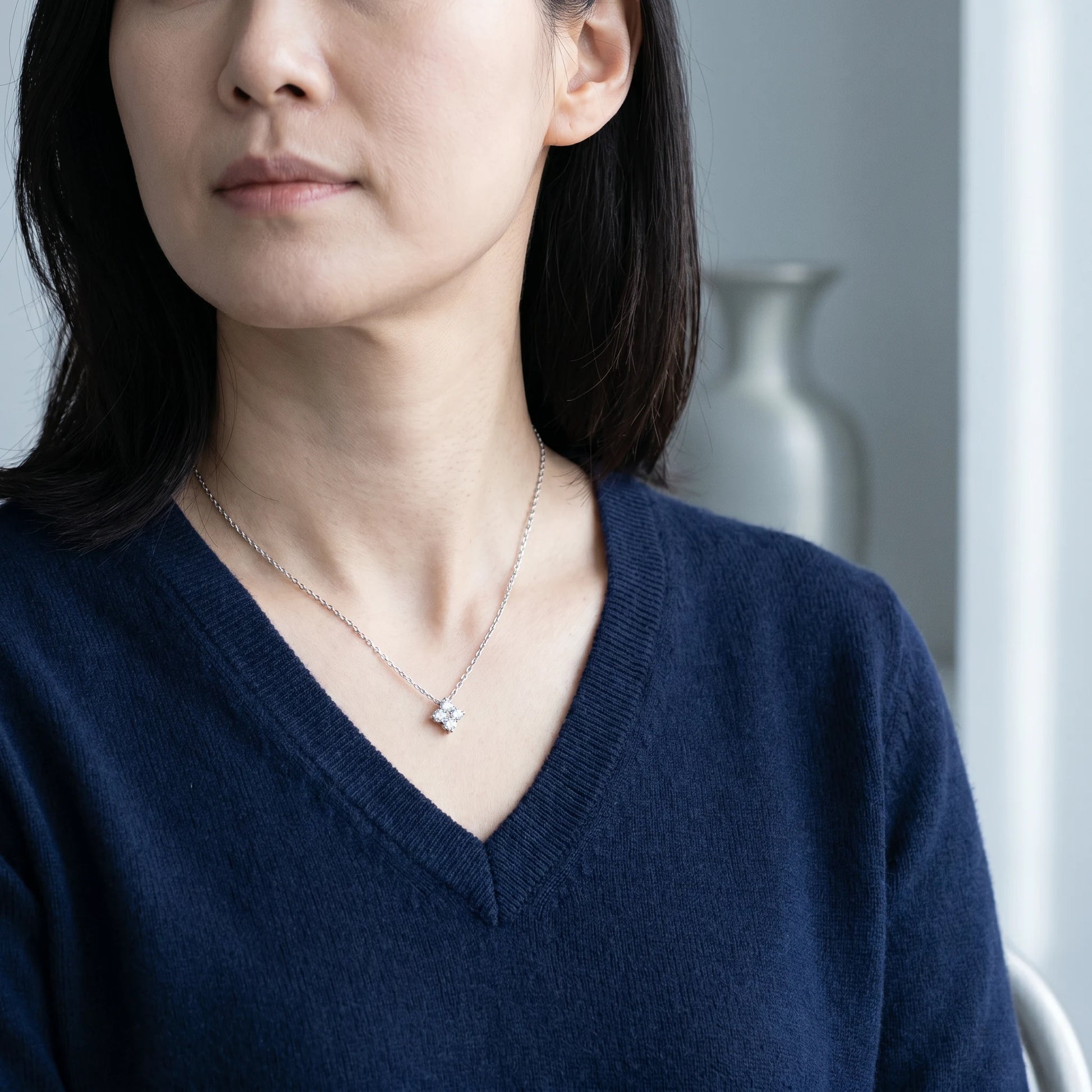 Diamond cluster necklace silver mature elegance Brooklyn brownstone editorial