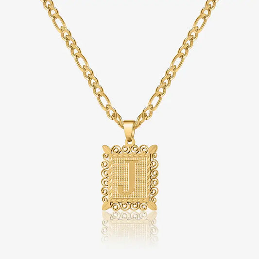 Embossed Initial Necklace with Figaro Chain by AUREATE featuring a gold 'J' pendant on a stylish chain.