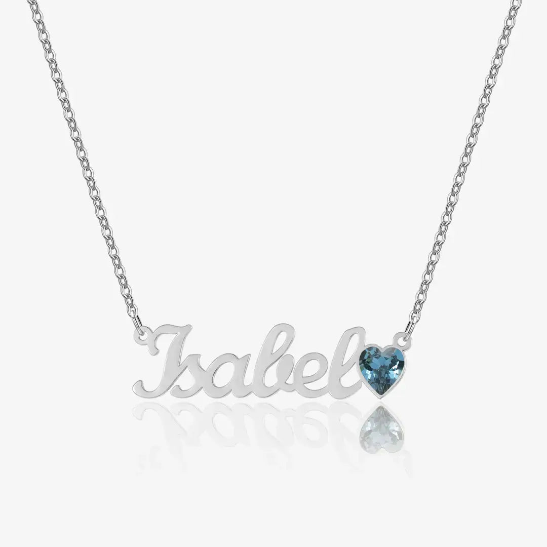 AUREATE Birthstone Personalised Name Necklace featuring a silver 'Isabel' pendant with a blue heart-shaped gemstone.