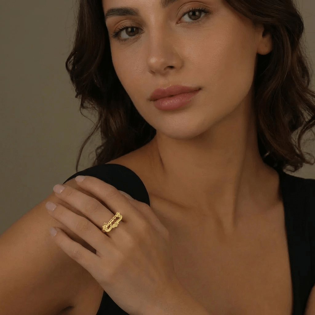 Woman showcasing a 3D Personalised Name Ring by AUREATE, featuring sculptural gold design.