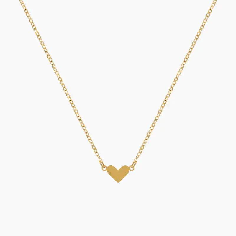 Classic Heart Pendant Necklace by AUREATE, a dainty gold necklace featuring a minimalist heart pendant.
