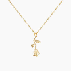 AUREATE Rose Charm Necklace featuring a detailed gold rose pendant on a delicate chain.