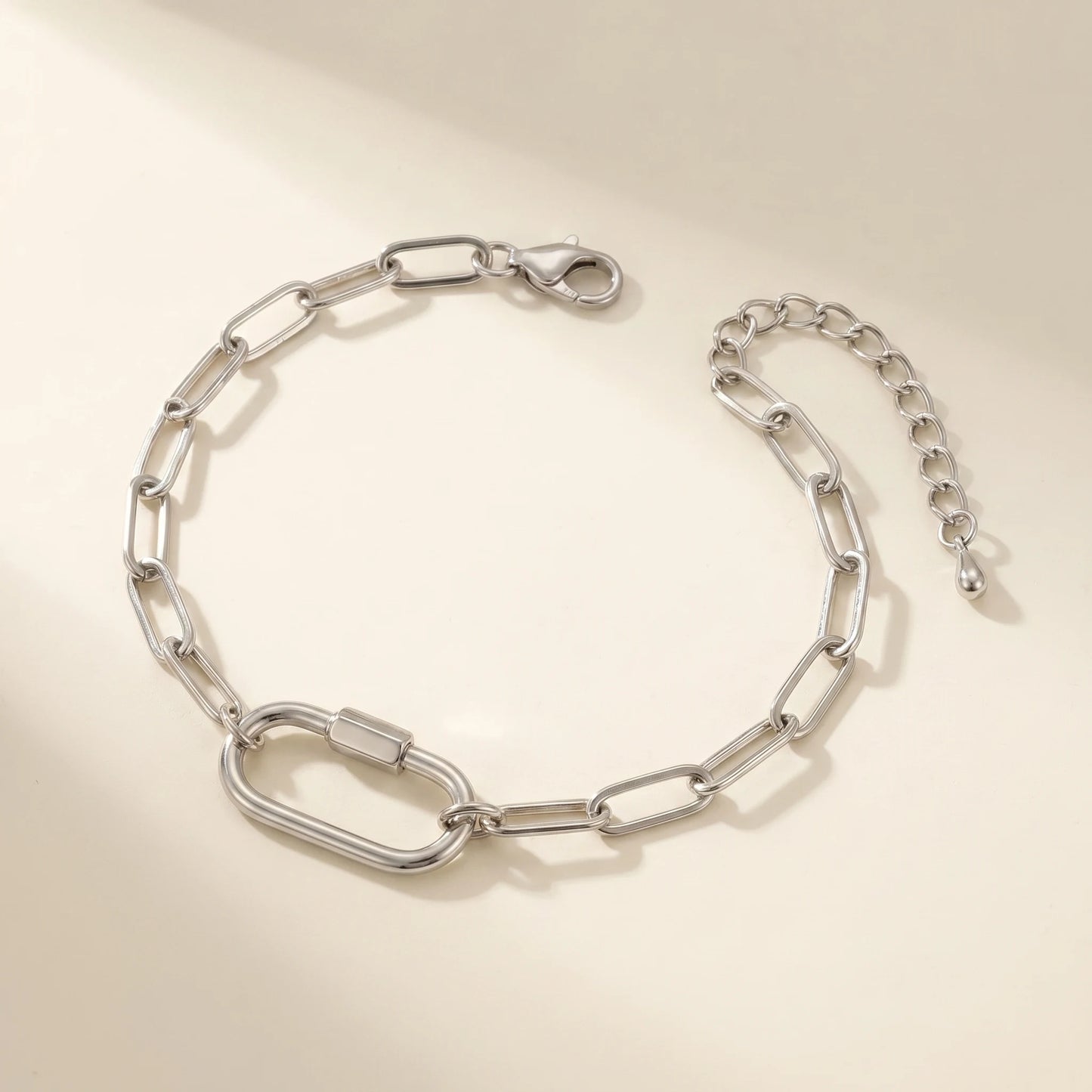 Silver paperclip bracelet with oval lock pendant - packshot stainless steel with 3cm cable extender chain