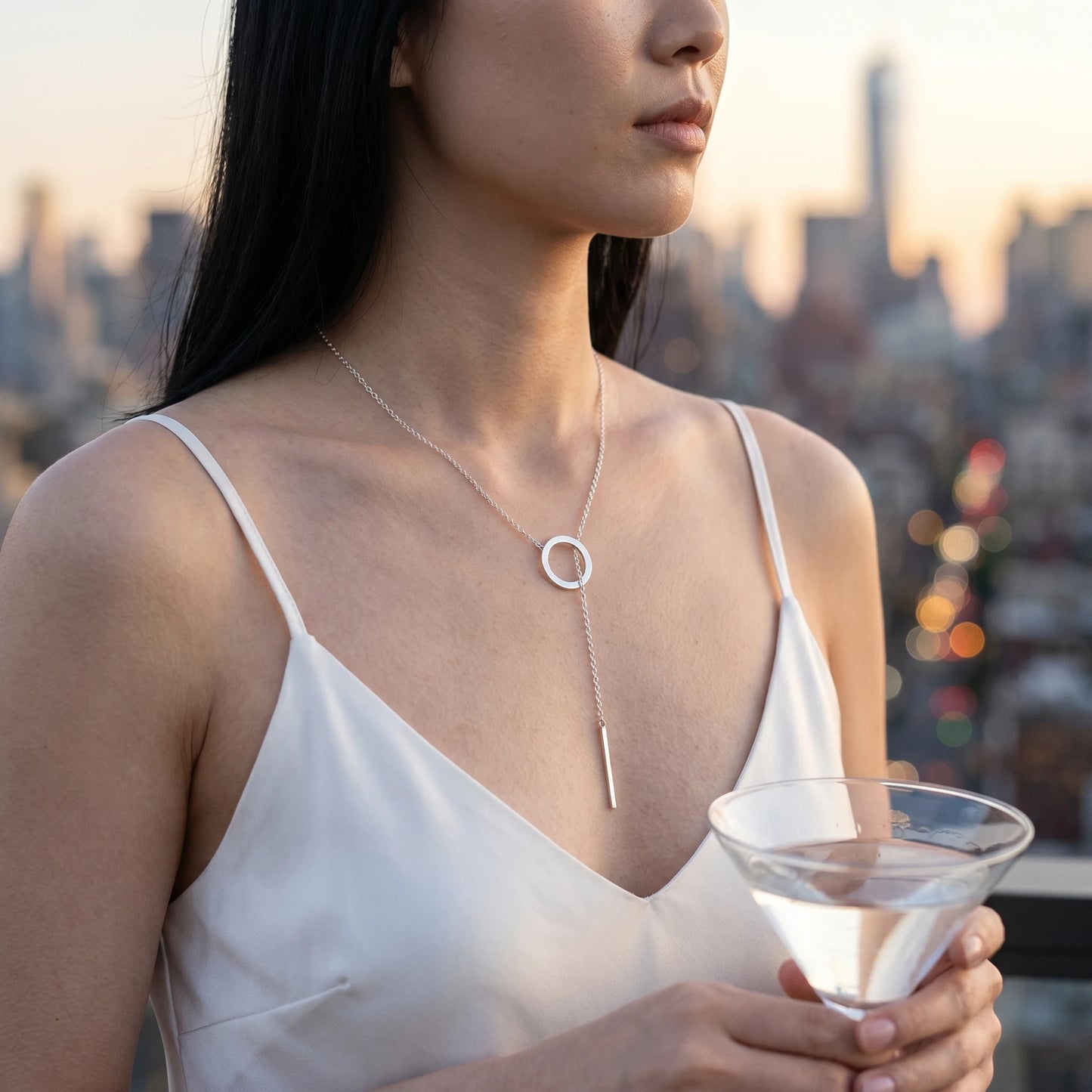 Silver Y-lariat necklace rooftop cocktail Manhattan twilight