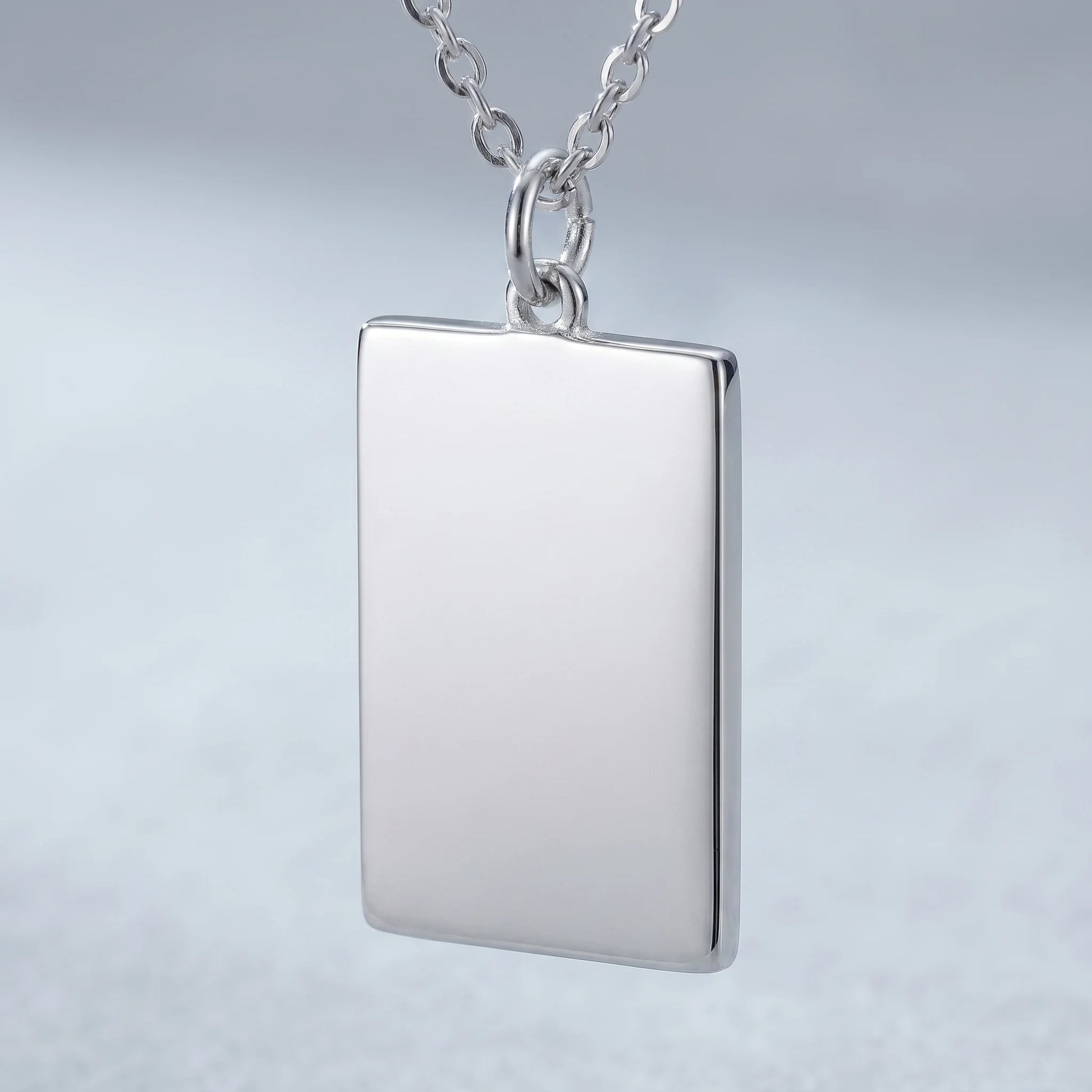Silver rectangle pendant macro detail polished blank front sharp orthogonal corners