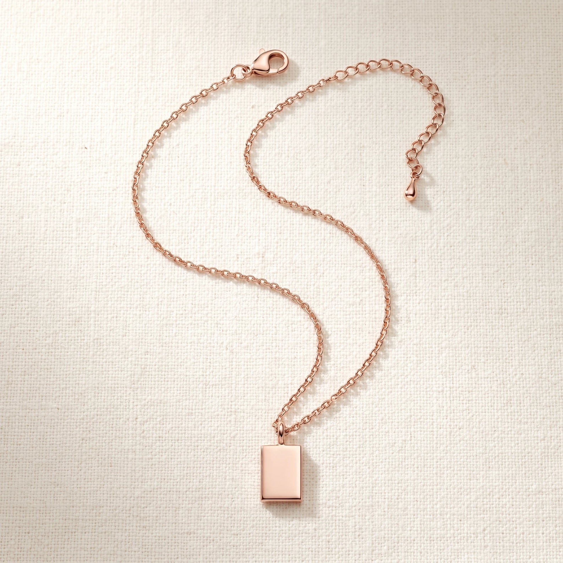 Rose gold rectangle pendant necklace packshot S-curve sharp corners chain connected