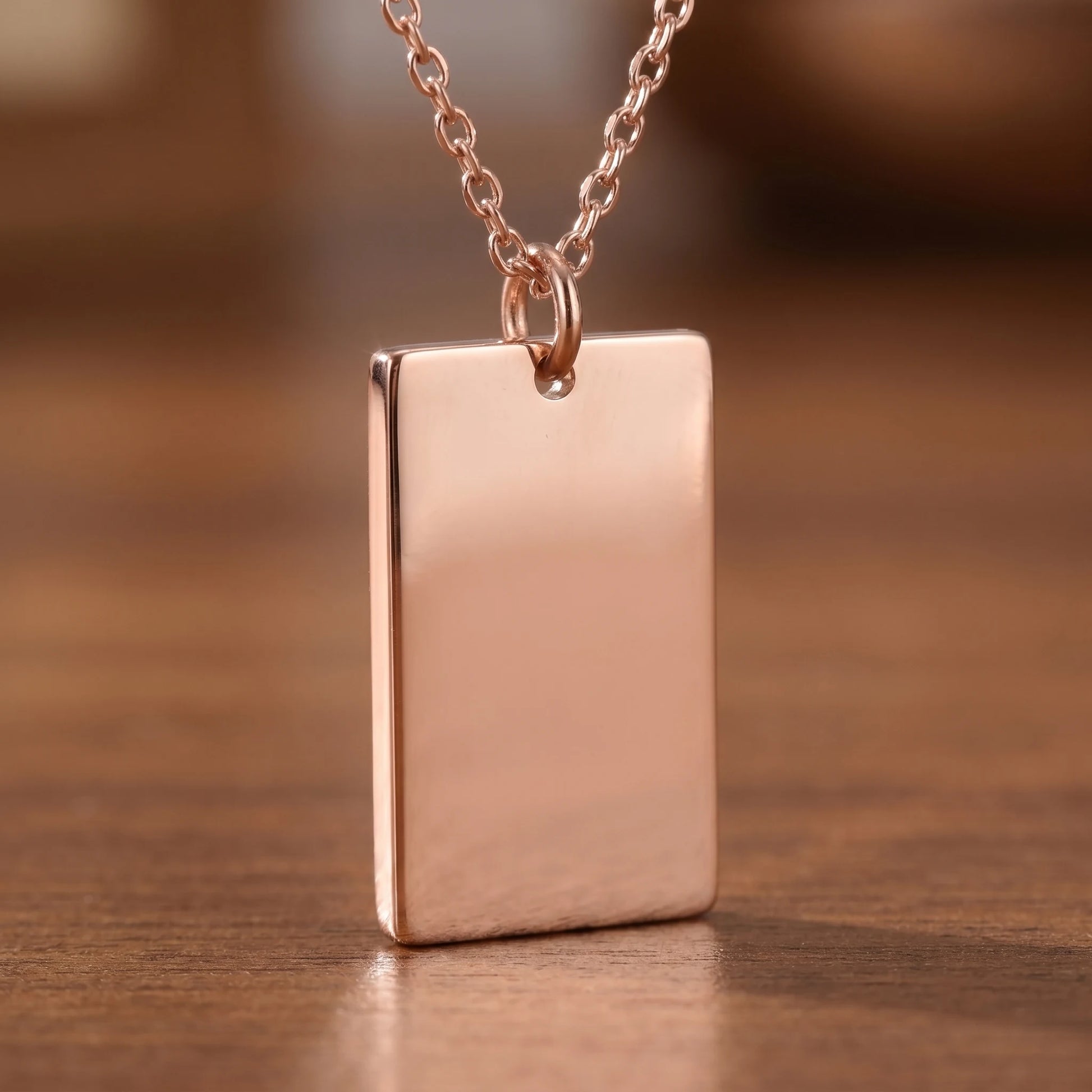 Rose gold rectangle pendant macro detail polished sharp orthogonal corners