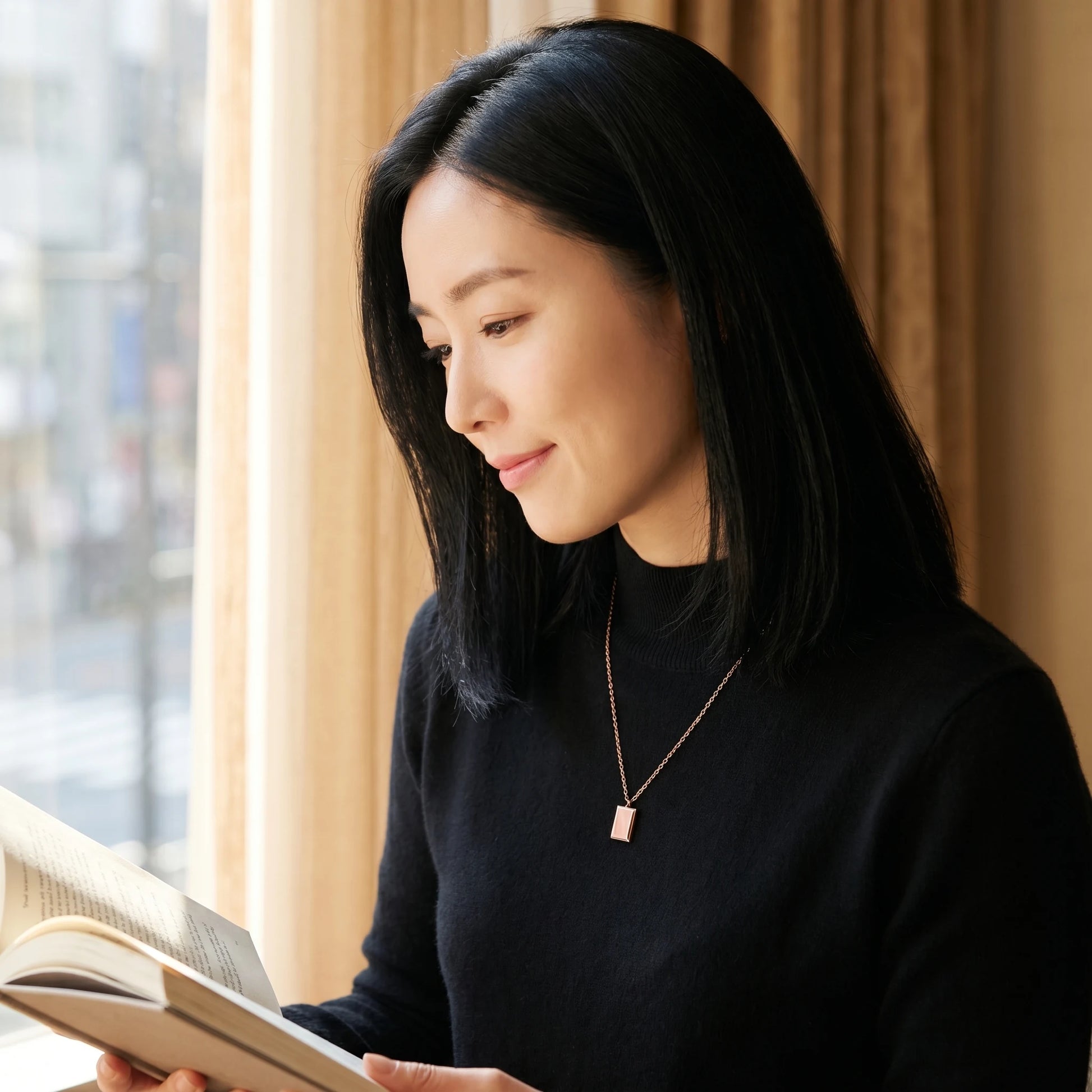 Rose gold rectangle pendant profile editorial Korean reading book black turtleneck