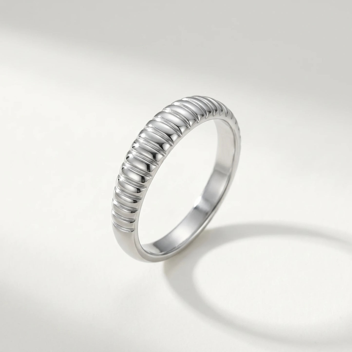 Dainty croissant dome ring silver packshot cool ivory background