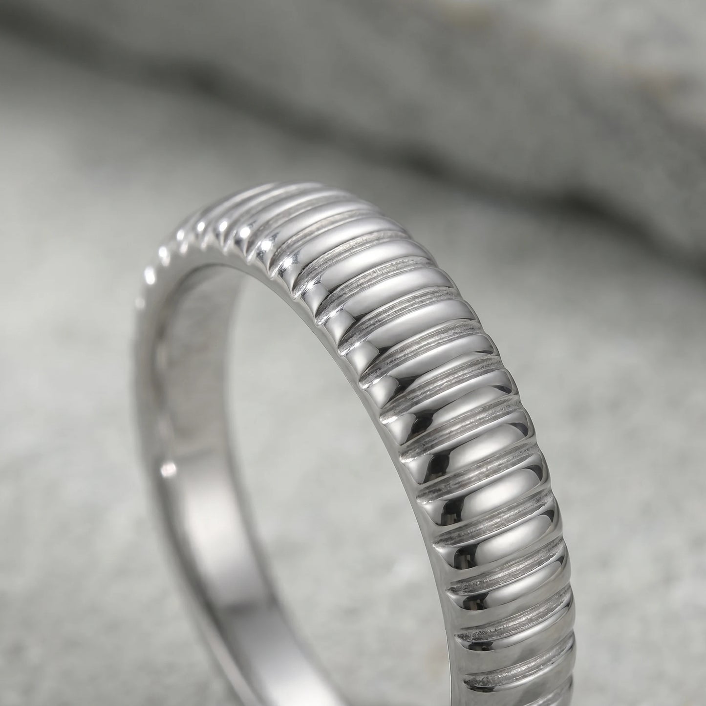 Dainty croissant dome ring silver macro fine ribbed grooves detail