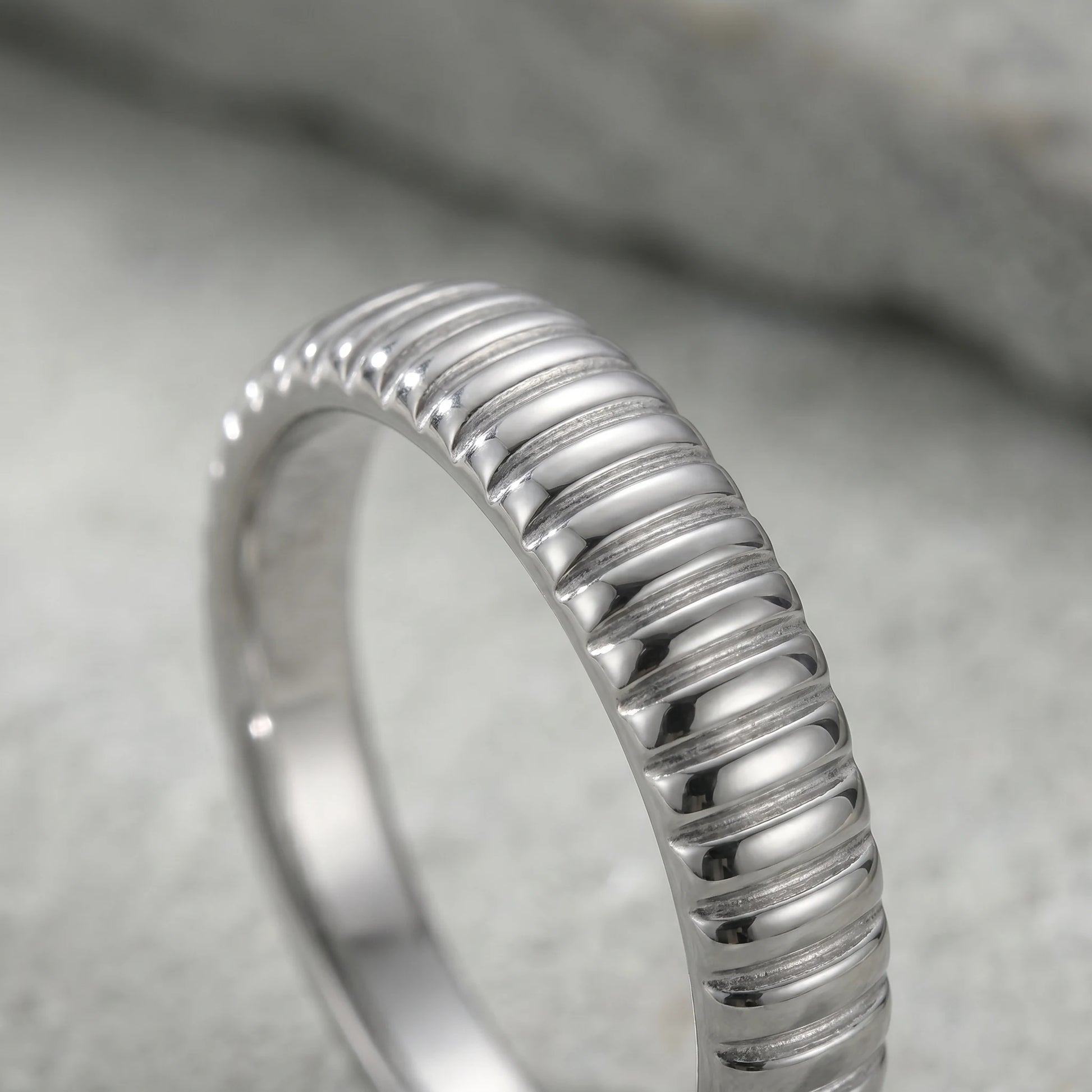 Dainty croissant dome ring silver macro fine ribbed grooves detail
