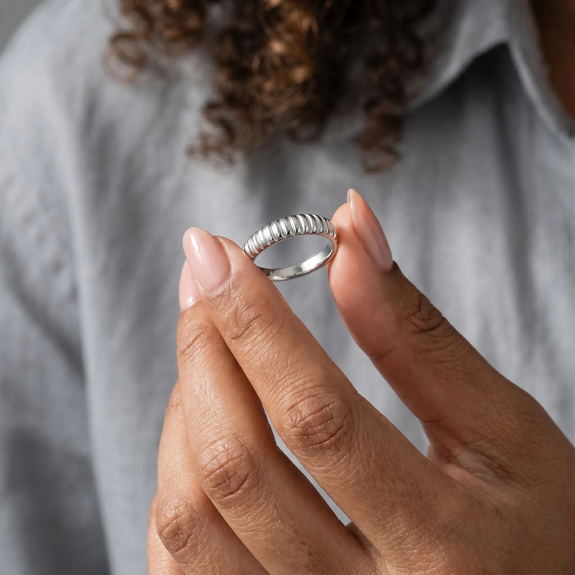Dainty croissant dome ring silver hand-held vertical