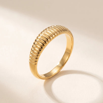 Dainty croissant dome ring gold packshot warm off-white background