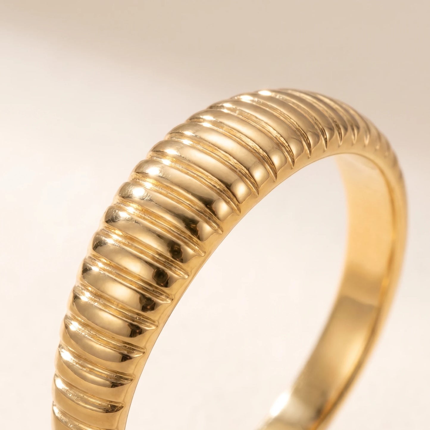 Dainty croissant dome ring gold macro fine ribbed grooves detail