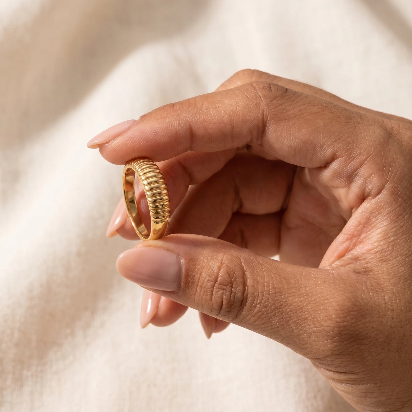 Dainty croissant dome ring gold hand-held vertical