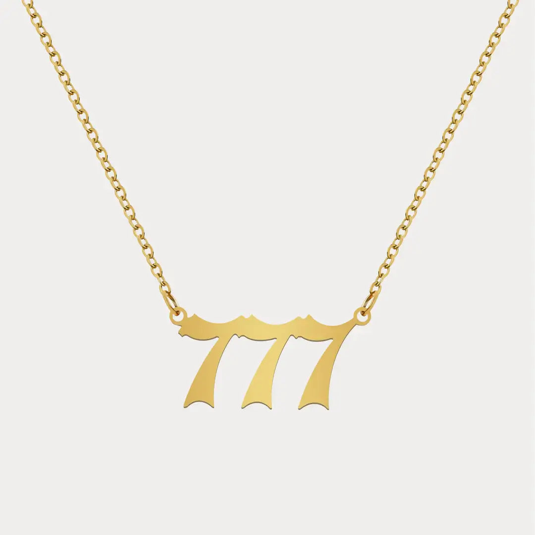 Angel Number Pendant Necklace by AUREATE featuring a gold 777 design for spiritual guidance.