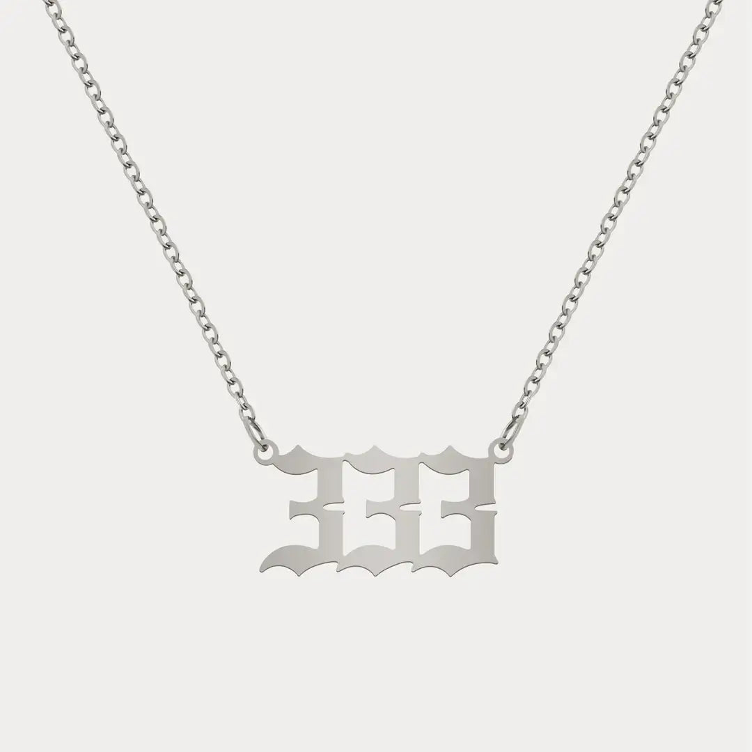 Angel Number Pendant Necklace by AUREATE featuring a 333 design on a silver chain.